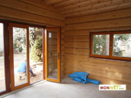 The interior of the log house with windows